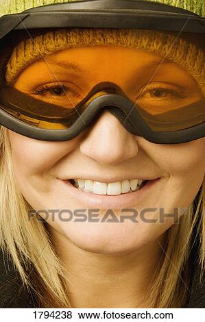 Woman wearing ski goggles View Large Photo Image Stock Photo - Woman wearing ski goggles. Fotosearch