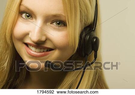 Woman with headset View Large Photo Image Stock Image - Woman with headset. Fotosearch