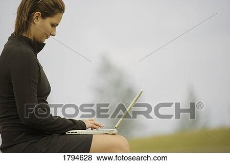 Woman with laptop View Large Photo Image Stock Photo - Woman with laptop. Fotosearch