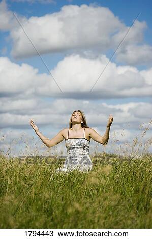 Stock Image - Woman worshipping. Fotosearch