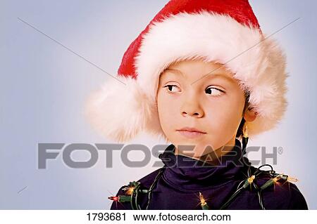 Stock Image - Young boy with Christmas outfit. Fotosearch