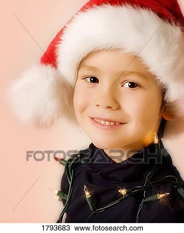 Stock Image - Young boy with Christmas outfit. Fotosearch