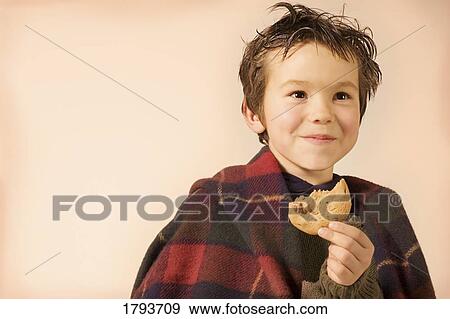 Young boy with cookie View Large Photo Image Stock Photo - Young boy with cookie. Fotosearch