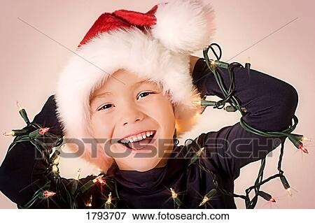 Young boy wrapped in Christmas lights View Large Photo Image Stock Photo - Young boy wrapped in Christmas lights. Fotosearch