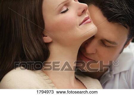 Stock Image - Young couple enjoying each other. Fotosearch