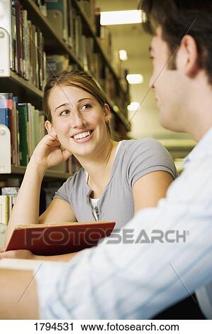 Young couple studying View Large Photo Image Stock Image - Young couple studying. Fotosearch