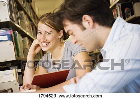 Young couple studying View Large Photo Image Stock Photo - Young couple studying. Fotosearch