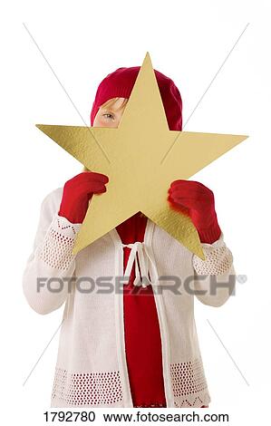 Young girl with Christmas star View Large Photo Image Stock Image - Young girl with Christmas star. Fotosearch