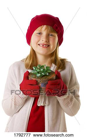 Stock Photo - Young girl with present. Fotosearch