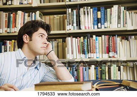 Young man daydreaming View Large Photo Image Stock Image - Young man daydreaming. Fotosearch
