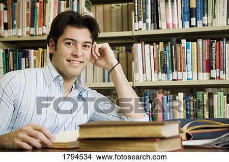 Young man studying View Large Photo Image Picture - Young man studying. Fotosearch