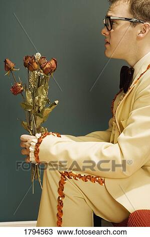 Stock Image - Young man waiting for a date. Fotosearch