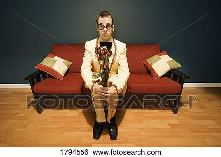 Stock Photograph - Young nerd waiting for date. Fotosearch