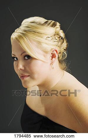Stock Photography - Young woman in black dress. Fotosearch