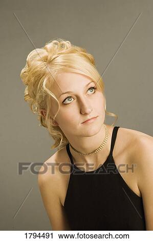 Stock Image - Young woman posing. Fotosearch