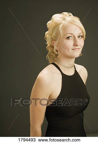 Stock Image - Young woman posing. Fotosearch