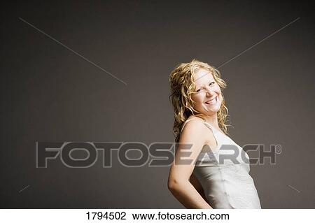 Stock Image - Young woman posing. Fotosearch