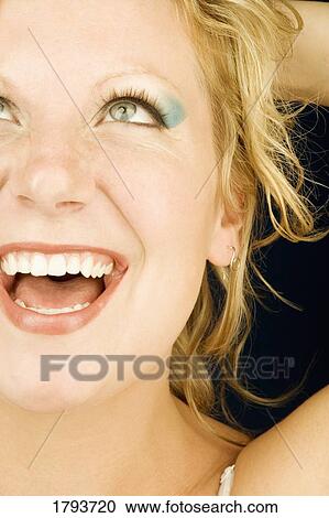 Young woman smiling View Large Photo Image Stock Image - Young woman smiling. Fotosearch