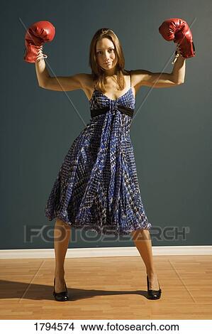 Young woman with boxing gloves View Large Photo Image Picture - Young woman with boxing gloves. Fotosearch