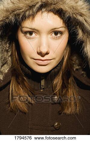 Stock Photograph - Young woman with fur hood . Fotosearch
