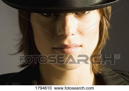 Young woman with top hat View Large Photo Image Stock Image - Young woman with top hat. Fotosearch
