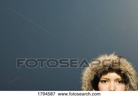 Stock Photo - Young woman with winter coat. Fotosearch