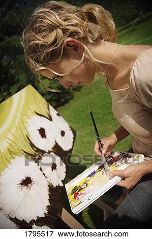 Artist painting on canvas View Large Photo Image Stock Photo - Artist painting on canvas. Fotosearch