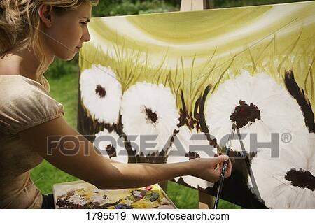 Artist painting on canvas View Large Photo Image Stock Photo - Artist painting on canvas. Fotosearch