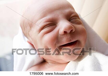 Stock Photograph - Baby smiling. Fotosearch