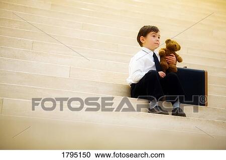 Stock Image - Boy travelling alone. Fotosearch