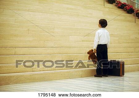 Stock Photo - Boy travelling alone. Fotosearch