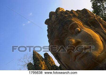 Buddhist head statues, Angkor Wat Temple Complex, Angkor Thom, Cambodia View Large Photo Image Stock Photo - Buddhist head statues, Angkor Wat Temple Complex, Angkor Thom, Cambodia. Fotosearch