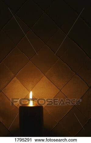 Stock Image - Candle burning. Fotosearch