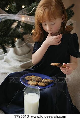 Child eating milk and cookies View Large Photo Image Stock Image - Child eating milk and cookies. Fotosearch