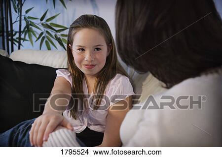 Picture - Daughter reaches out to mother. Fotosearch