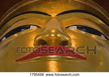 Stock Photo - Face of Golden Buddha, in Bagan Temple Myanmar (Burma). Fotosearch