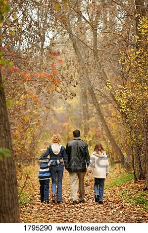 Family walking down path View Large Photo Image Stock Image - Family walking down path. Fotosearch