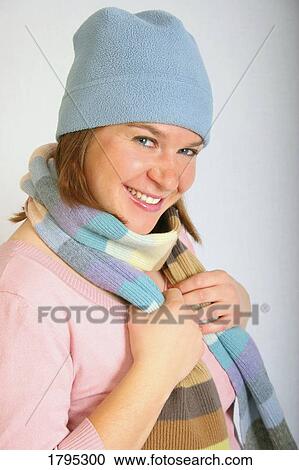 Stock Image - Female with a hat and scarf. Fotosearch