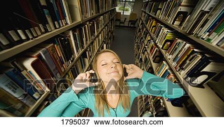 Girl listening to music View Large Photo Image Stock Photo - Girl listening to music. Fotosearch