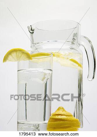 Stock Image - Glass and pitcher of water. Fotosearch