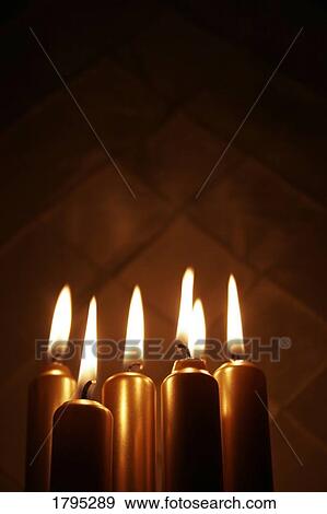 Group of lit candles View Large Photo Image Stock Photo - Group of lit candles. Fotosearch
