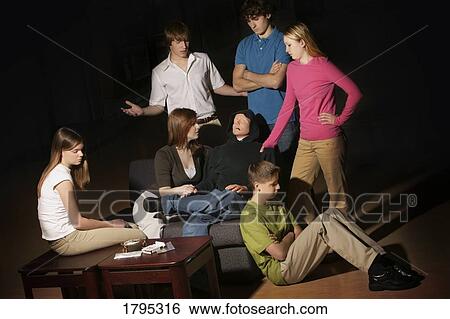 Stock Photograph - Group of teens having an intervention. Fotosearch