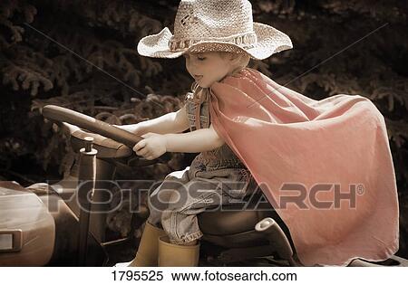 Little guy at the steering wheel View Large Photo Image Stock Photography - Little guy at the steering wheel. Fotosearch
