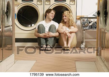 Stock Photo - Love at the laundry-mat. Fotosearch