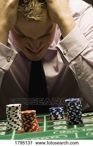 Man loosing at gambling View Large Photo Image Stock Image - Man loosing at gambling. Fotosearch