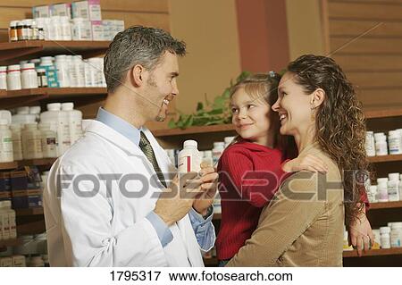 Stock Photo - Mother talking with a pharmacist. Fotosearch
