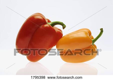 Stock Photo - Orange and red peppers. Fotosearch