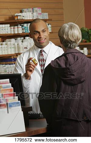 Pharmacist and patient View Large Photo Image Stock Image - Pharmacist and patient. Fotosearch