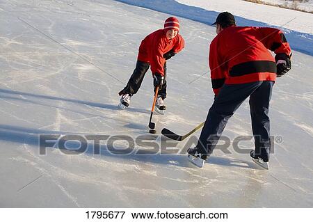 Playing hockey View Large Photo Image Stock Photo - Playing hockey. Fotosearch