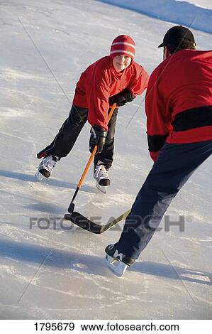 Playing hockey View Large Photo Image Stock Photo - Playing hockey. Fotosearch